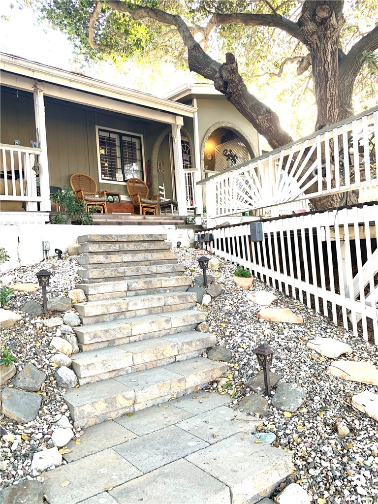 29043 Paradise Road Val Verde, CA 91384 - Photo 23 of 23 a view of a house with a bench