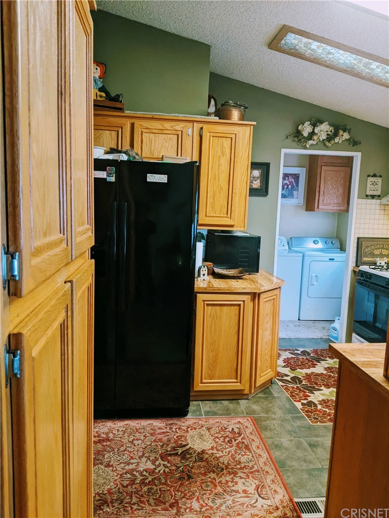 29043 Paradise Road Val Verde, CA 91384 - Photo 9 of 23 a bathroom with a sink a mirror and a shower