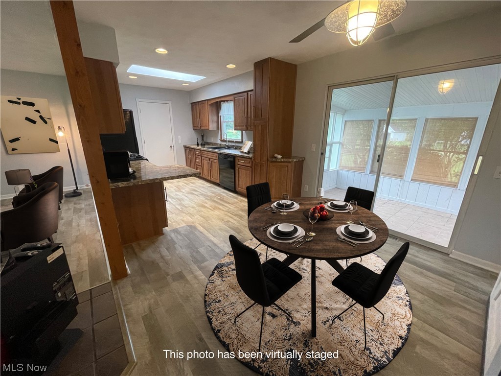 2345 Antioch Road Perry, OH 44081 - Photo 6 of 17 Dining area with sink, ceiling fan, and light hardwood / wood-style floors