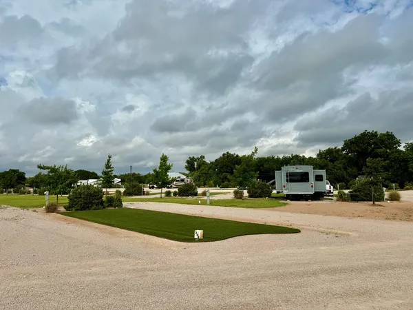 a view of a park with houses