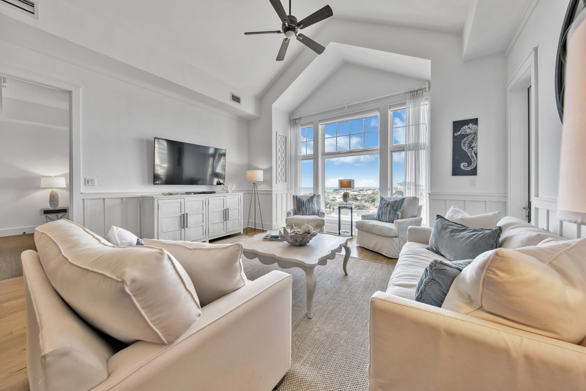99 Compass Point Way South, Unit 404 Inlet Beach, FL 32461 - Photo 5 of 19 a living room with furniture and a flat screen tv
