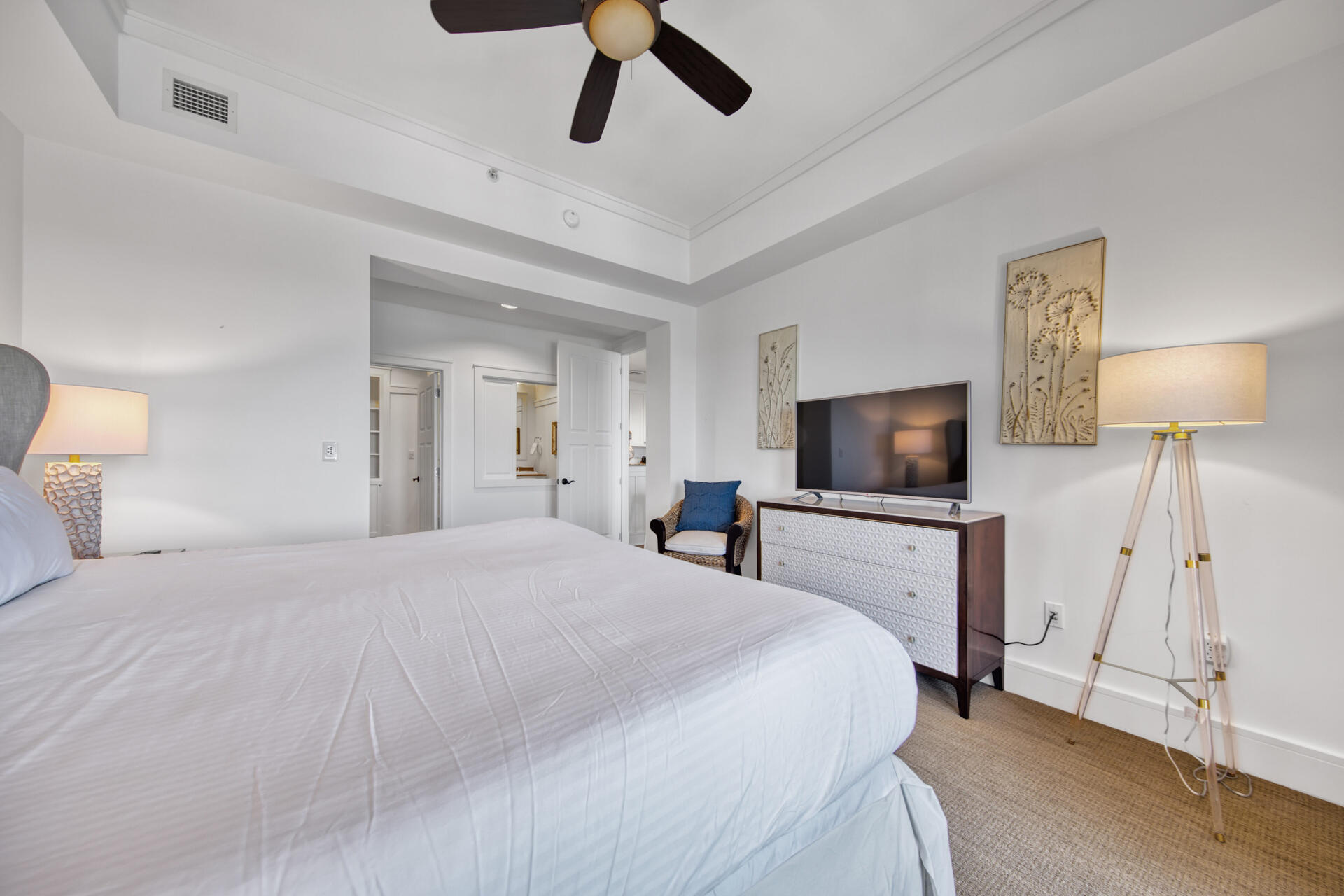 99 Compass Point Way South, Unit 404 Inlet Beach, FL 32461 - Photo 10 of 19 a bedroom with a bed and a flat screen tv