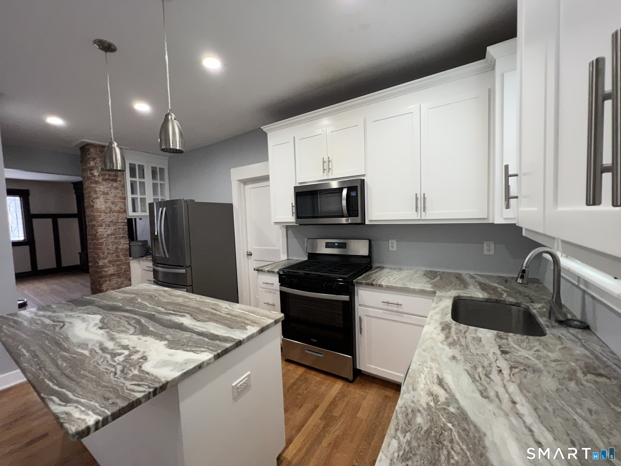 1546 Whitney Avenue Hamden, CT 06517 - Photo 1 of 21 a kitchen with a sink stove and refrigerator
