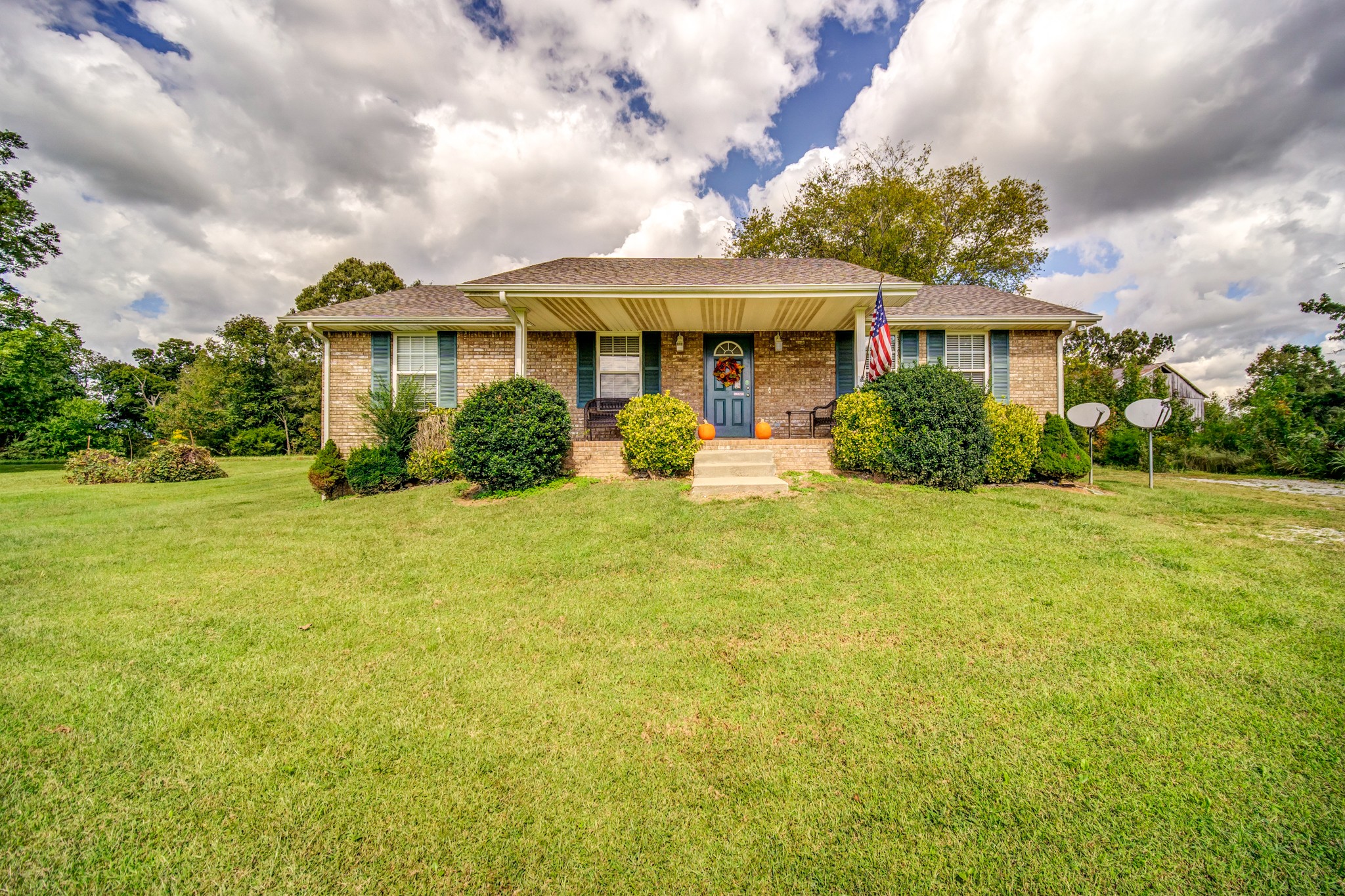 5407 Marion Road Cunningham, TN 37052 - Photo 1 of 35 a front view of a house with yard and green space