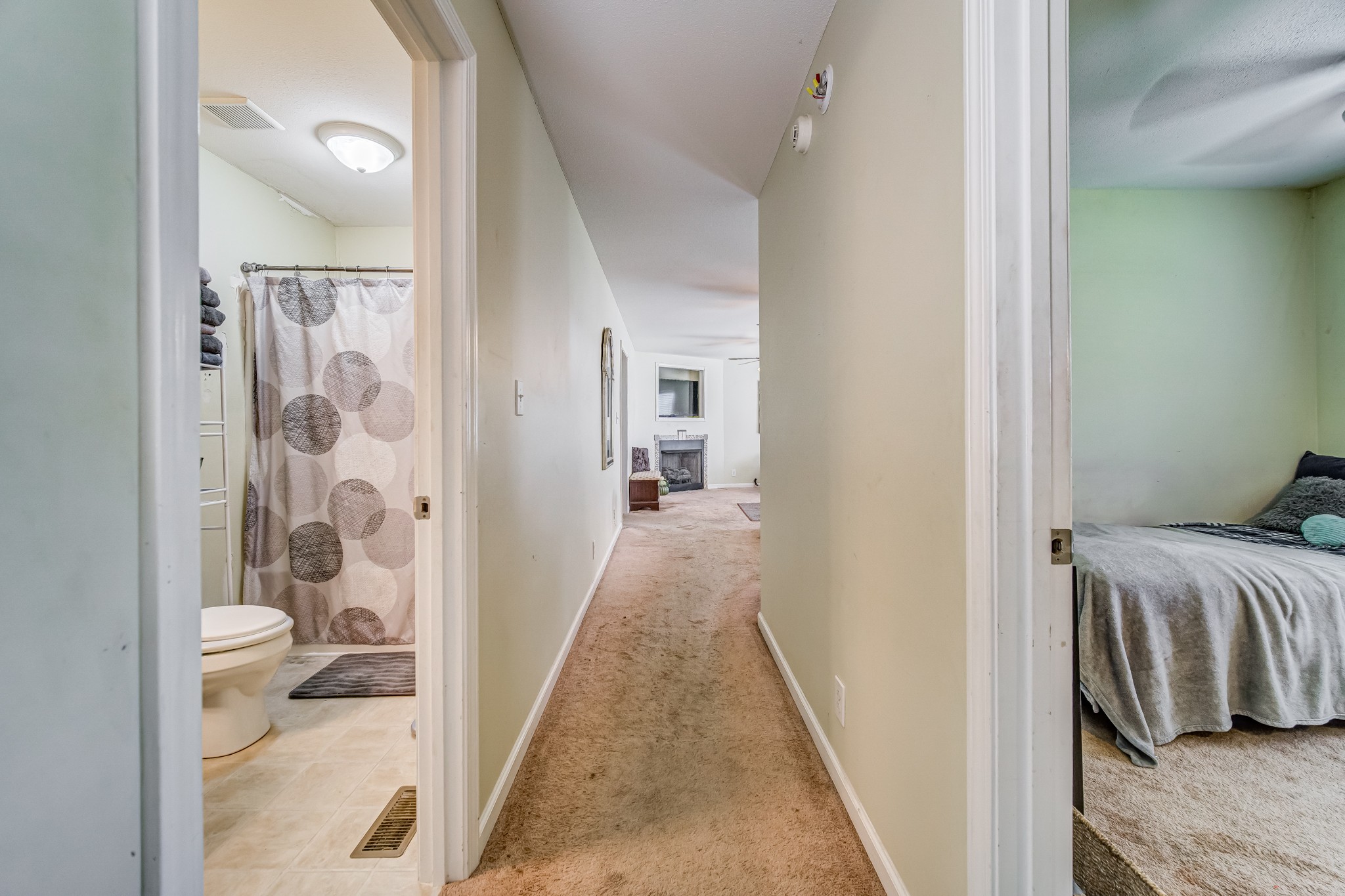 5407 Marion Road Cunningham, TN 37052 - Photo 11 of 35 a view of a hallway with a livingroom and a bathroom with sink