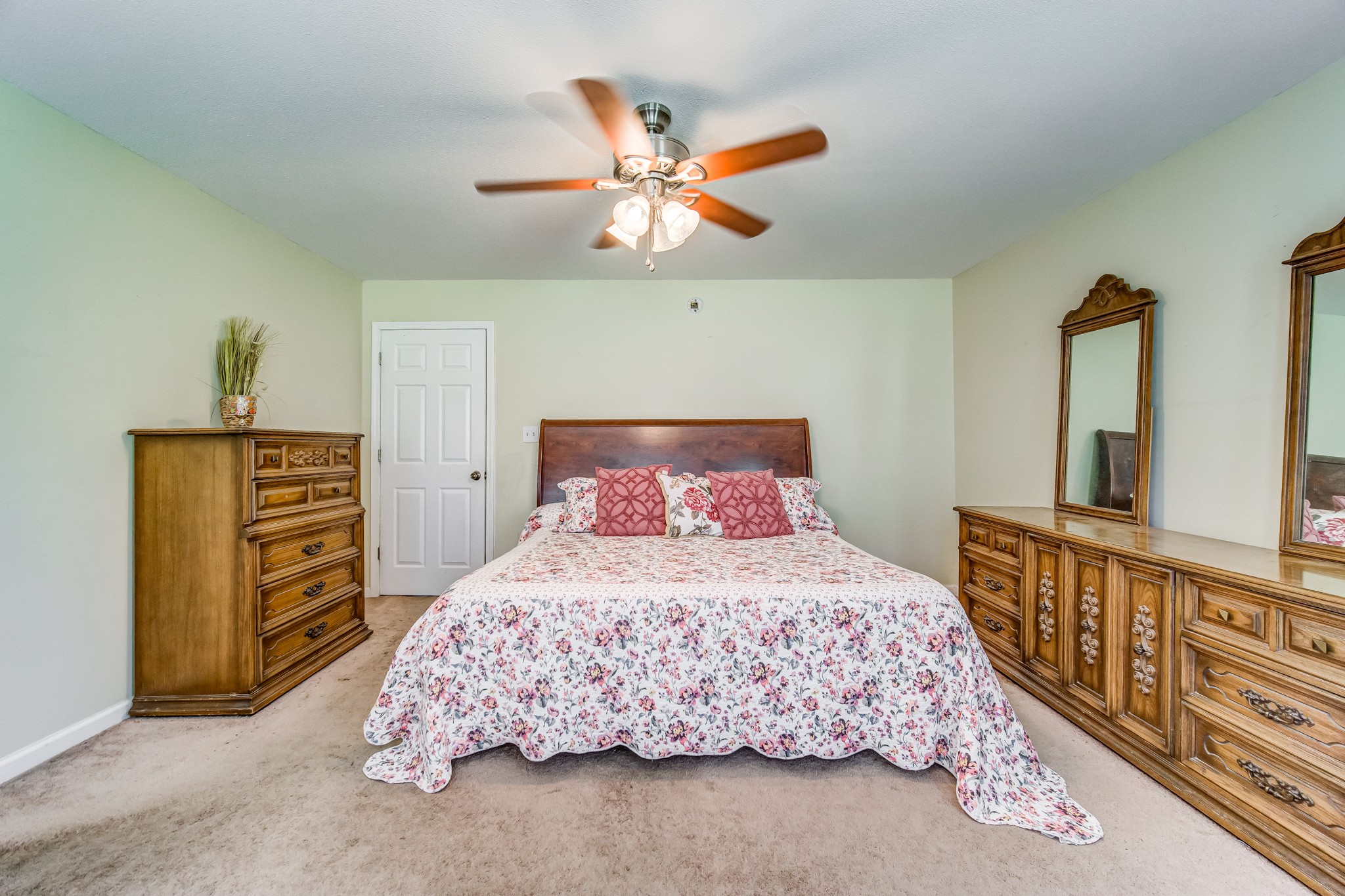 5407 Marion Road Cunningham, TN 37052 - Photo 13 of 35 a bedroom with a bed a dresser and potted plants