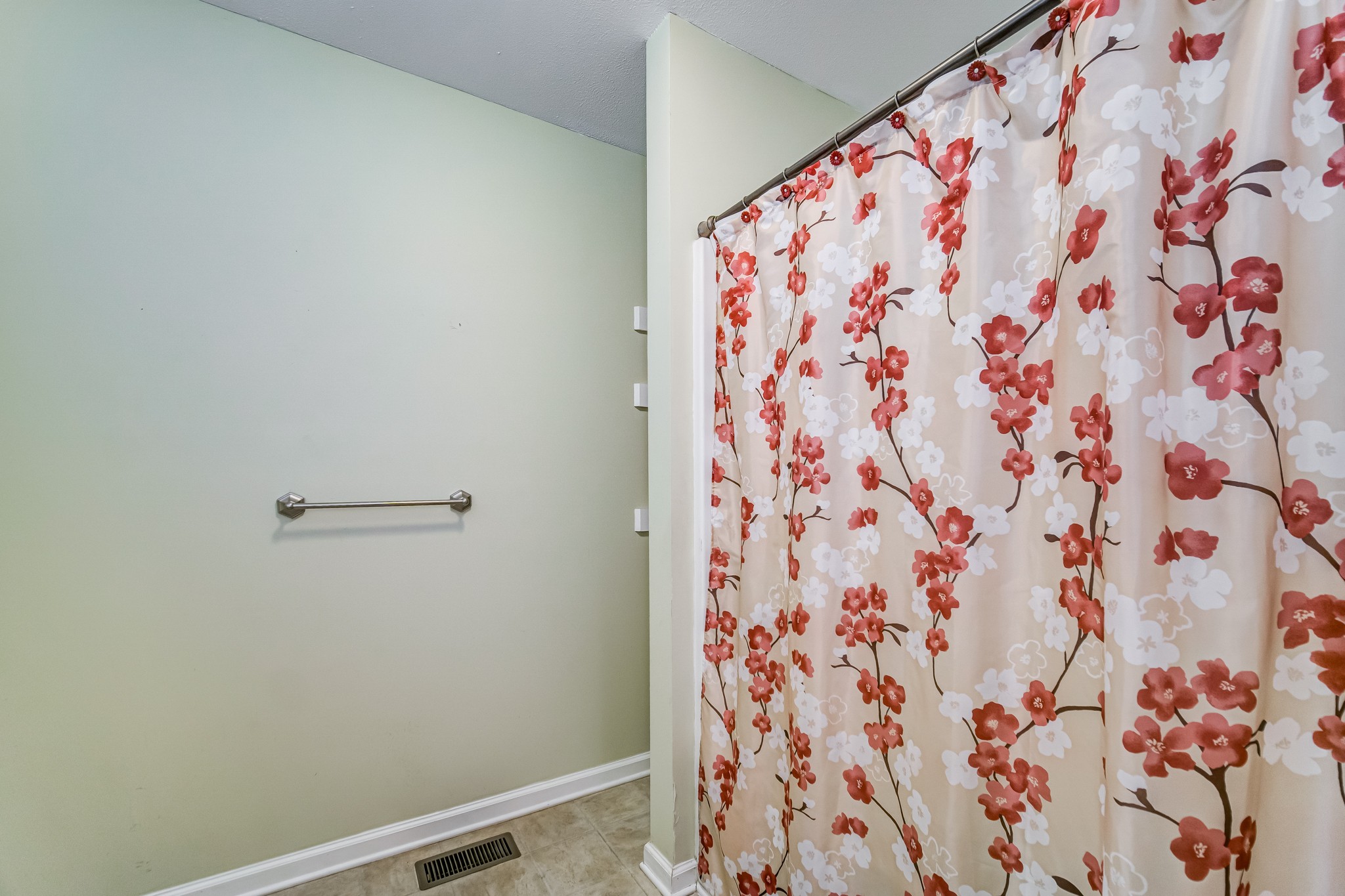 5407 Marion Road Cunningham, TN 37052 - Photo 16 of 35 a bathroom with a shower curtain