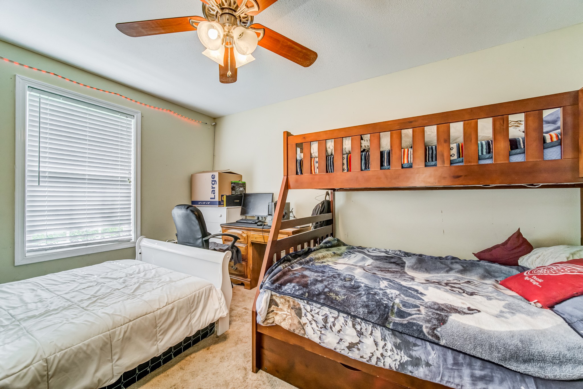 5407 Marion Road Cunningham, TN 37052 - Photo 18 of 35 a bedroom with a bed and a chandelier