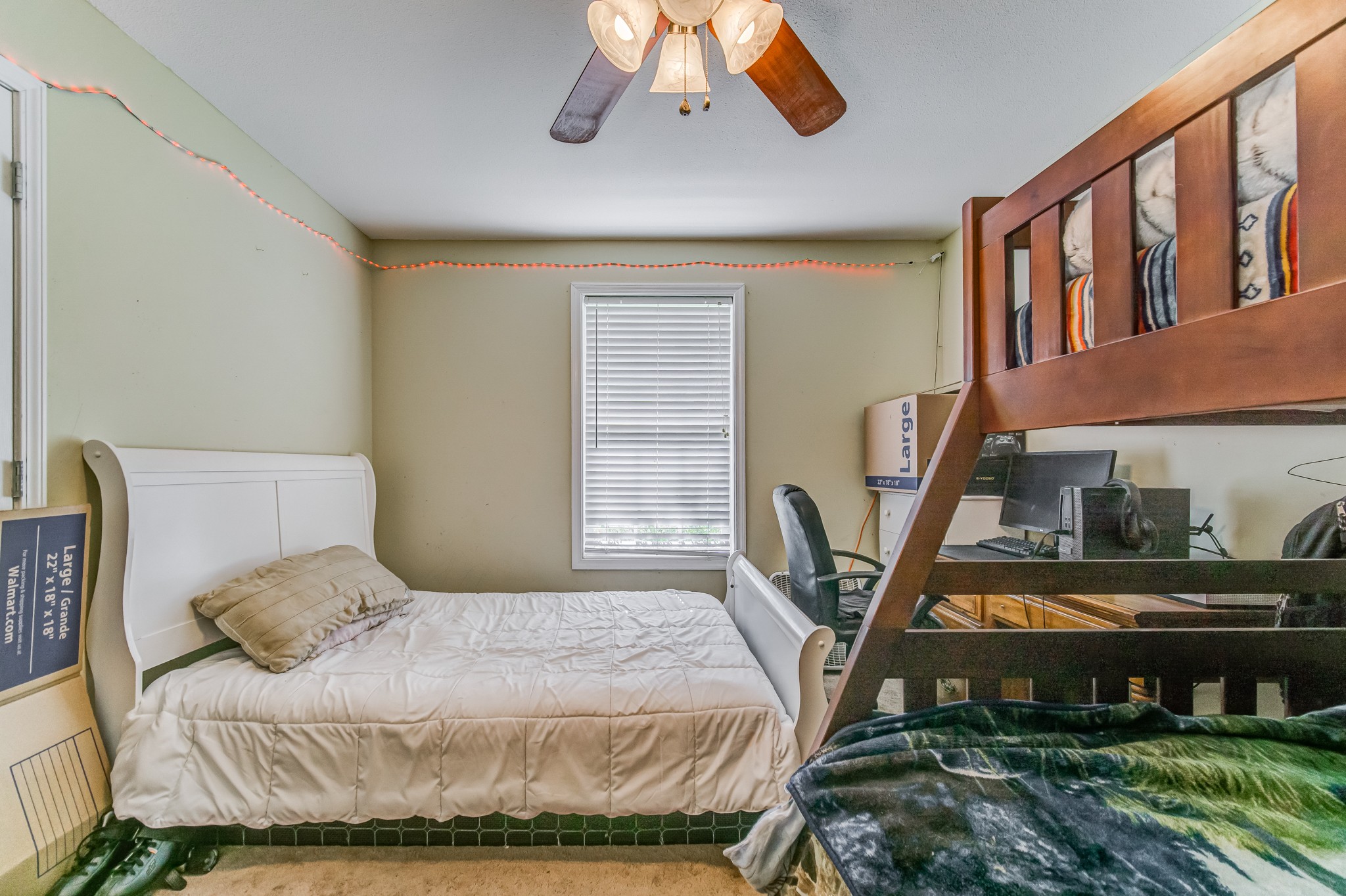 5407 Marion Road Cunningham, TN 37052 - Photo 19 of 35 a bedroom with a bed a chandelier and dresser