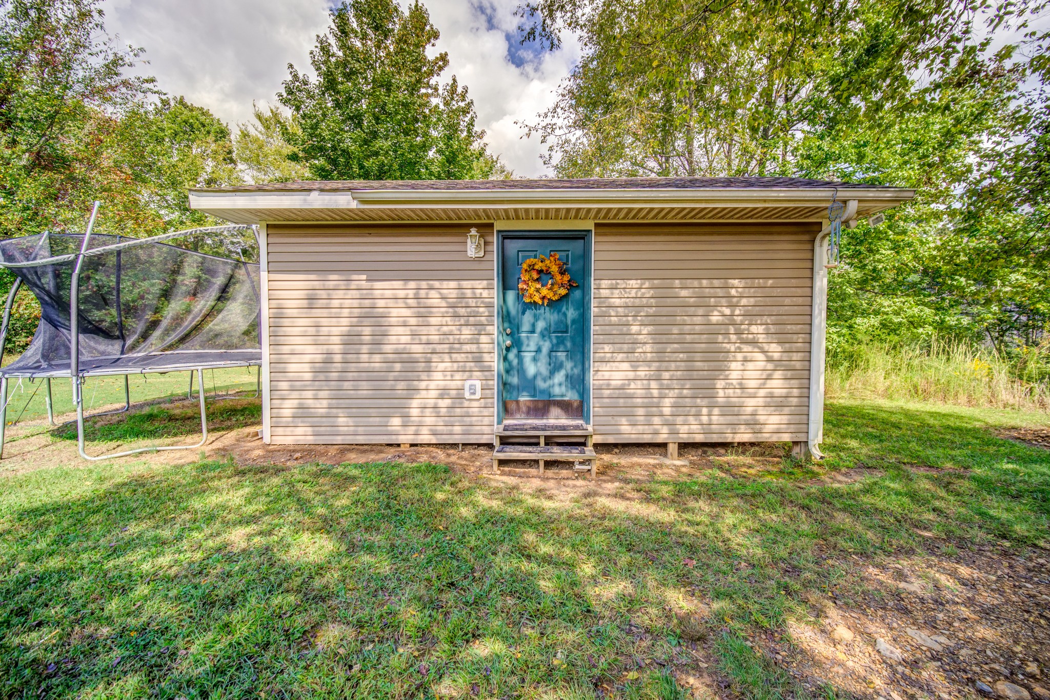 5407 Marion Road Cunningham, TN 37052 - Photo 29 of 35 a view of a house with a yard