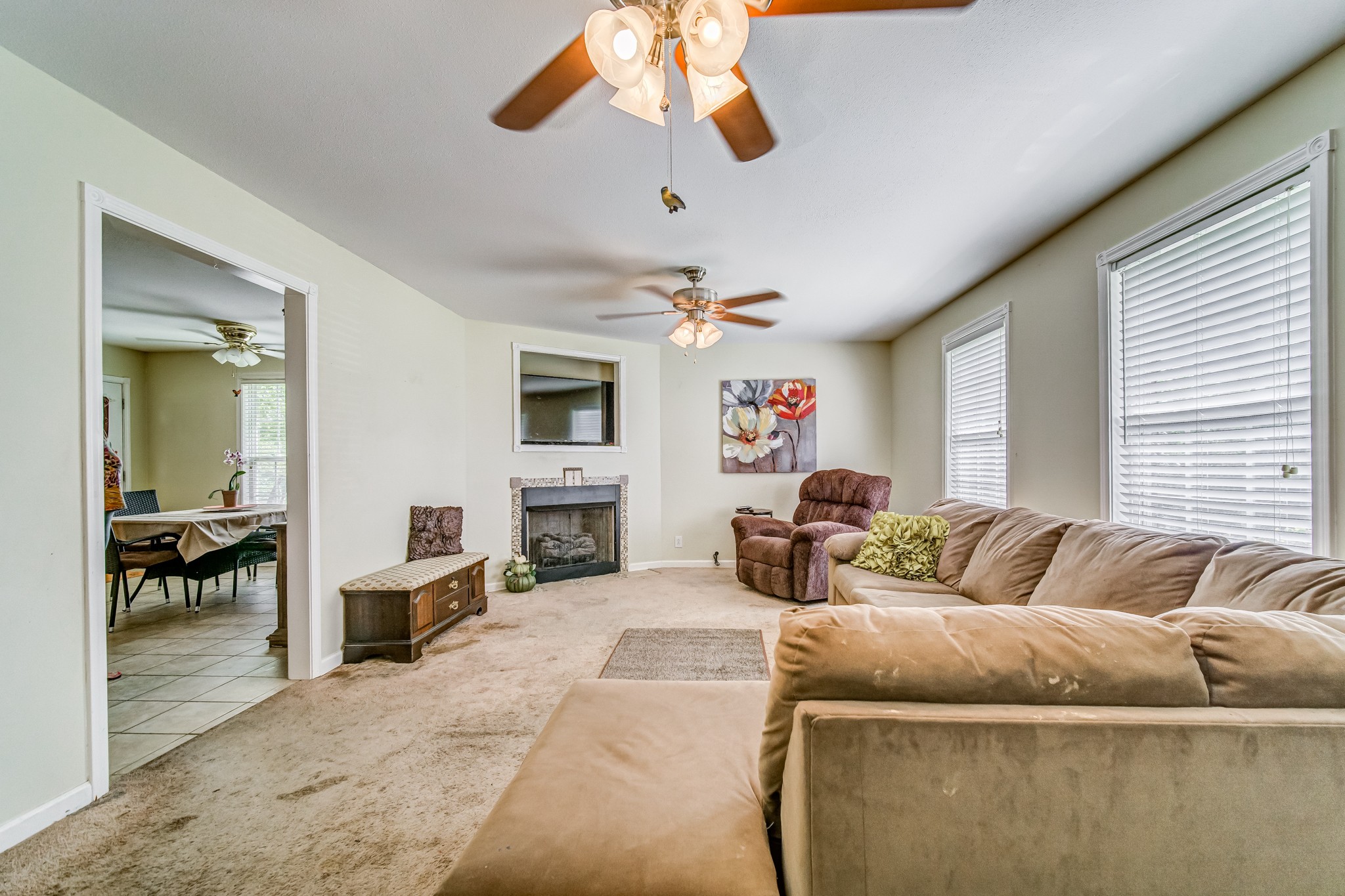 5407 Marion Road Cunningham, TN 37052 - Photo 3 of 35 a living room with furniture a fireplace and a flat screen tv