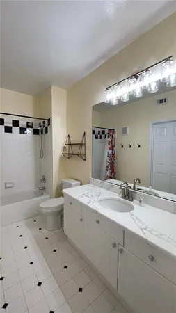 a bathroom with a sink double vanity and a shower