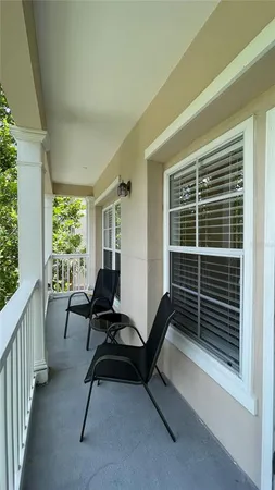 a view of a room with furniture and windows