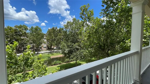 a view of a garden from a balcony