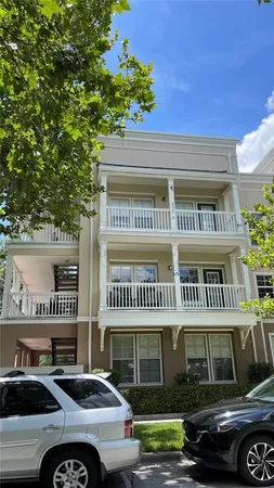 a front view of a residential apartment building with a yard