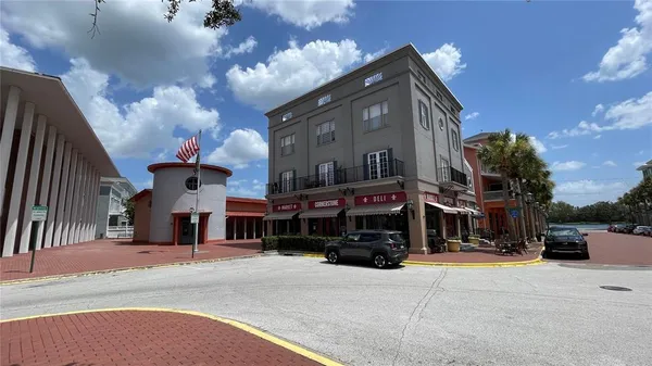 a view of a street that has a brick building