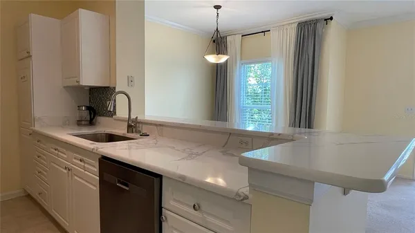 a kitchen with a sink and a window