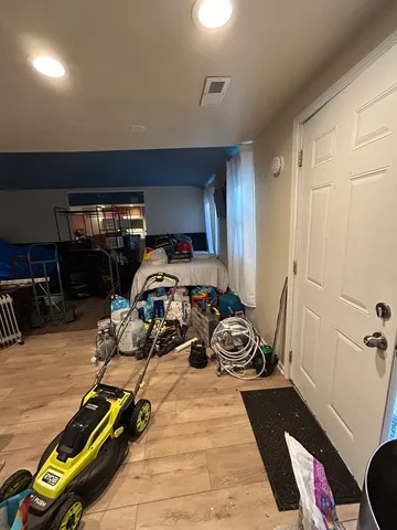 a room with furniture a gym equipment and a view of living room