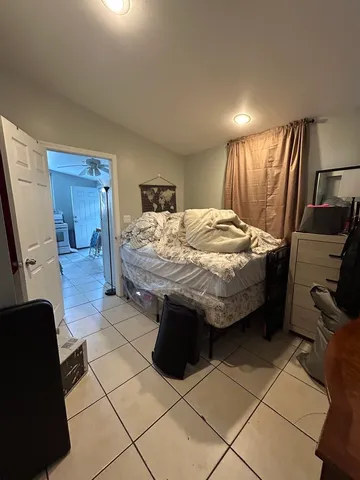 a living room with a couch and a flat screen tv