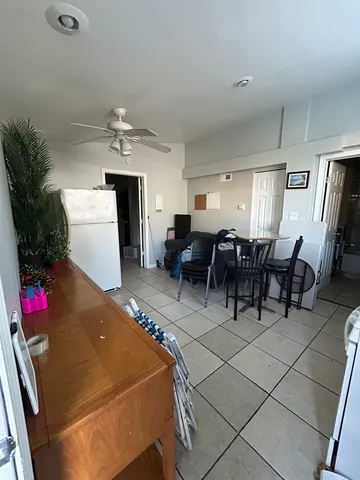 a room with lots of chairs and mirrors