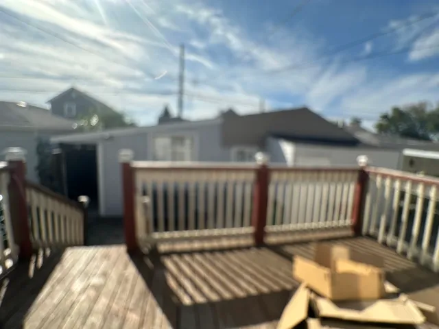 a view of balcony with wooden floor