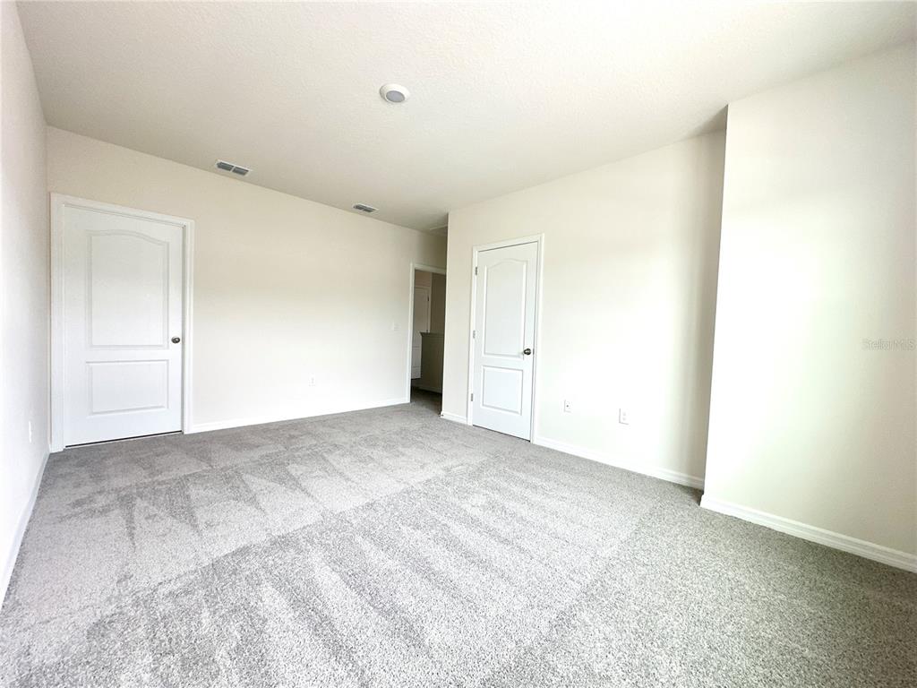 2742 Puffin Place Davenport, FL 33837 - Photo 21 of 31 a view of an empty room