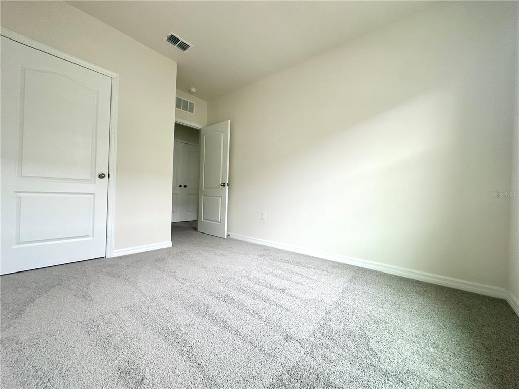 2742 Puffin Place Davenport, FL 33837 - Photo 24 of 31 a view of an empty room and closet area