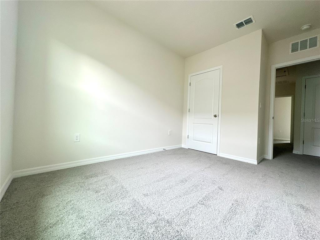 2742 Puffin Place Davenport, FL 33837 - Photo 25 of 31 a view of an empty room