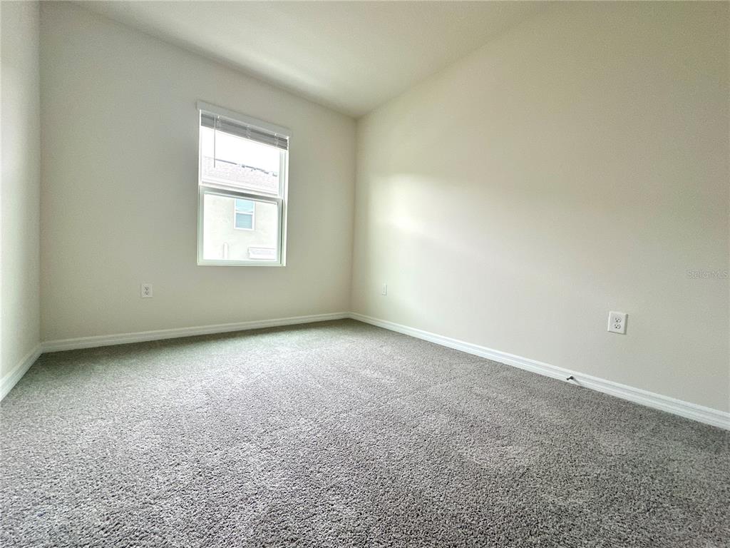 2742 Puffin Place Davenport, FL 33837 - Photo 26 of 31 an empty room with a window