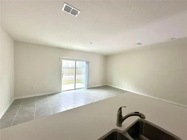 a kitchen with a sink stove and refrigerator
