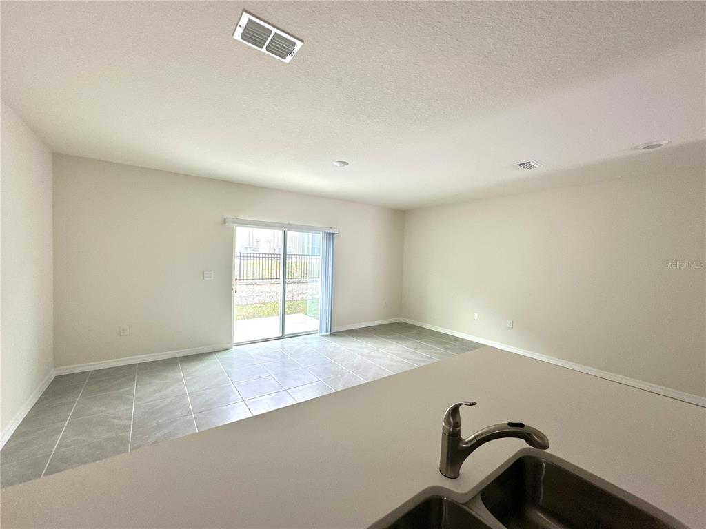 2742 Puffin Place Davenport, FL 33837 - Photo 9 of 31 a view of a room with a window