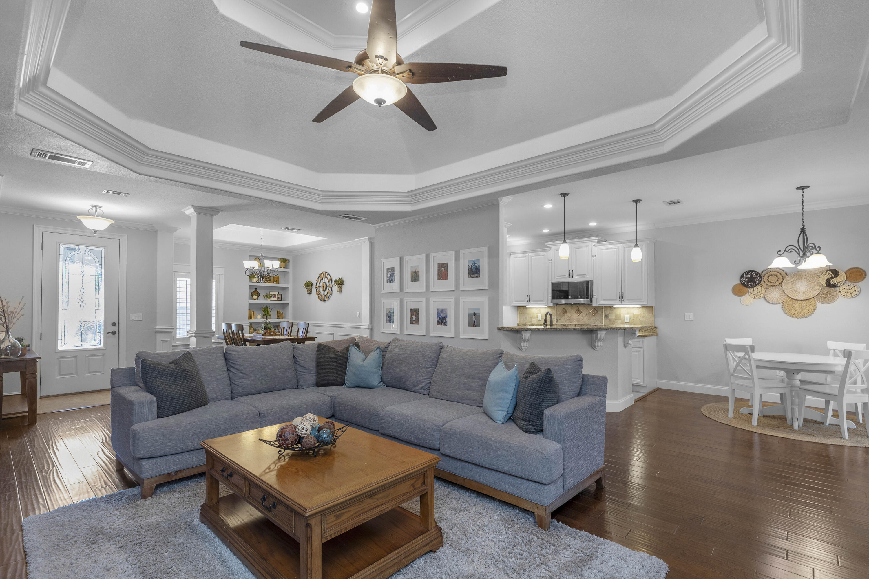 2946 Chantry Circle Crestview, FL 32539 - Photo 12 of 55 a living room with furniture kitchen view and a wooden floor