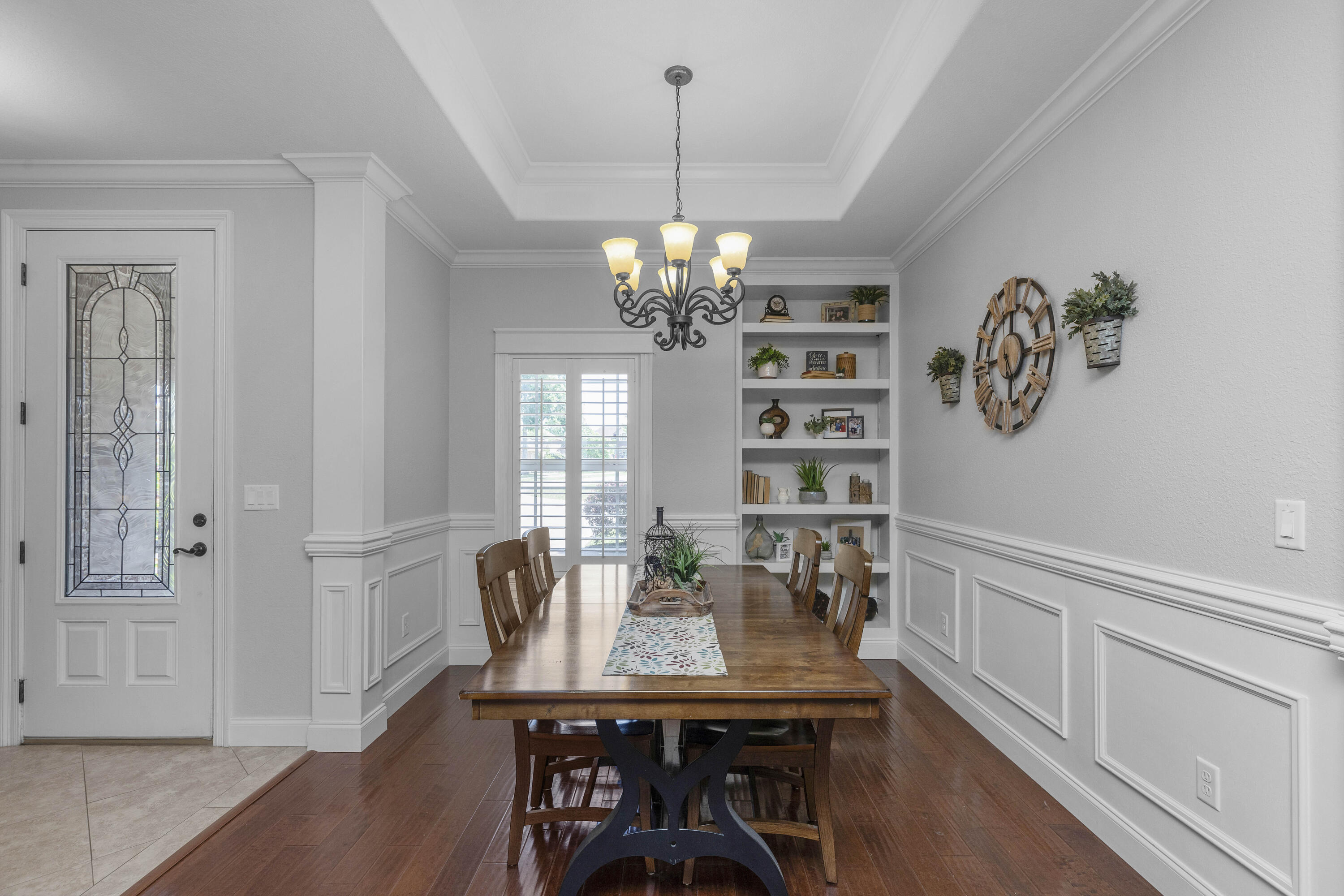 2946 Chantry Circle Crestview, FL 32539 - Photo 14 of 55 a view of a dining room with furniture a chandelier and wooden floor