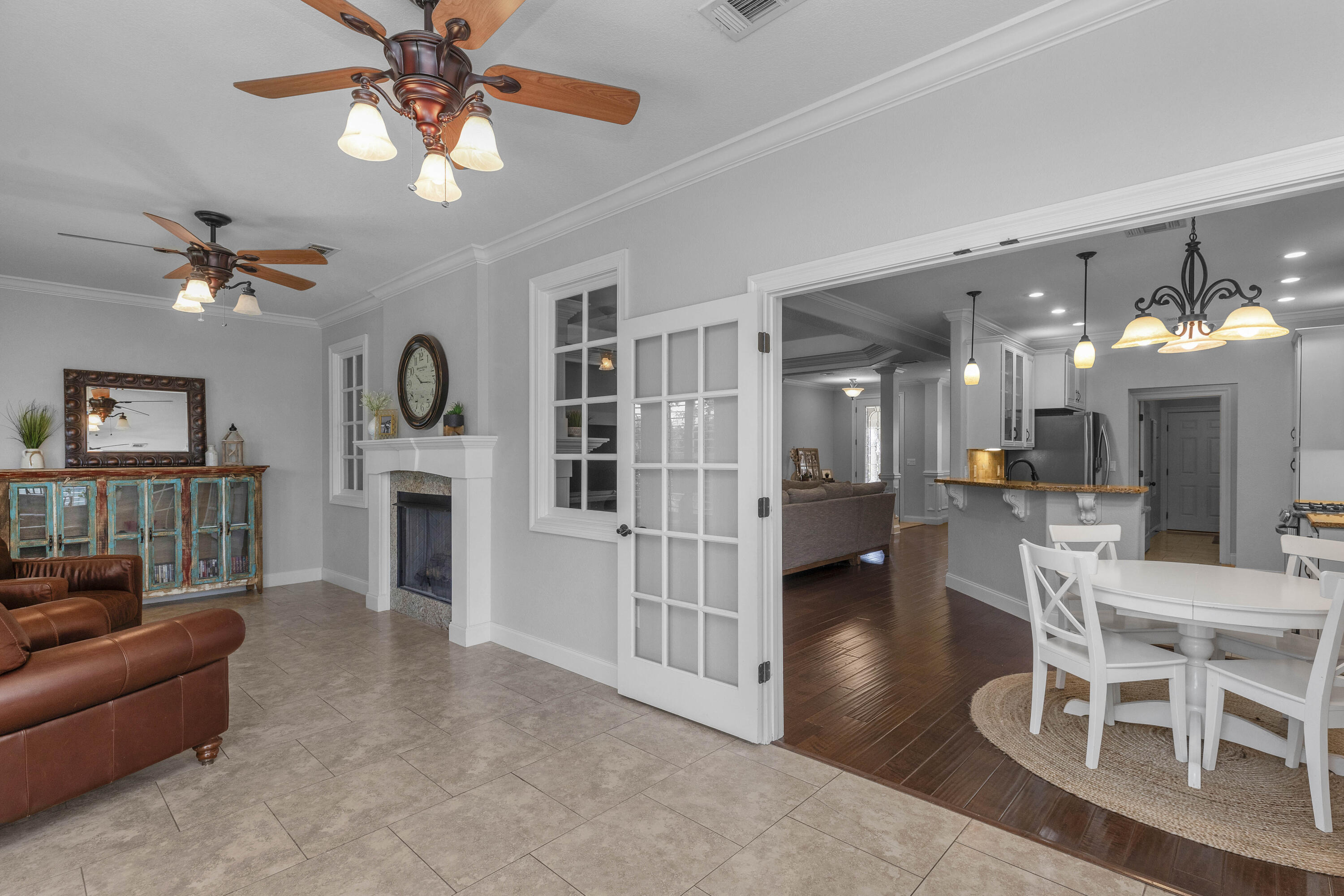 2946 Chantry Circle Crestview, FL 32539 - Photo 23 of 55 a living room with furniture and a chandelier