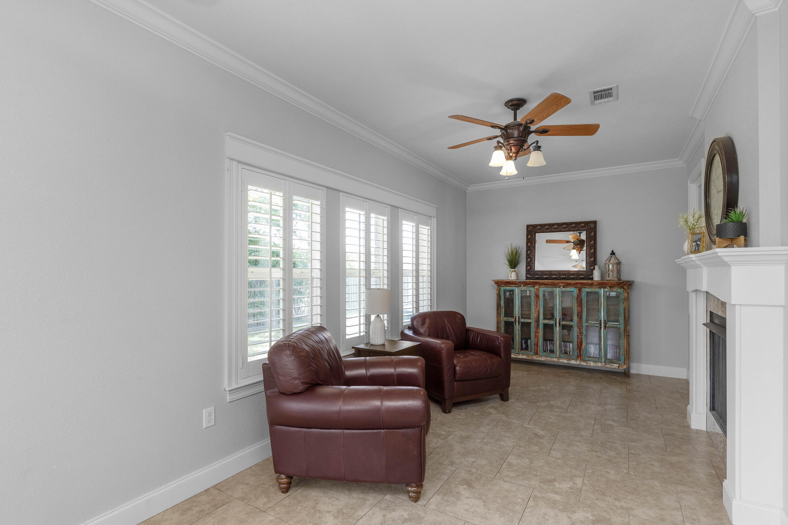 2946 Chantry Circle Crestview, FL 32539 - Photo 24 of 55 a living room with furniture ceiling fan and a window
