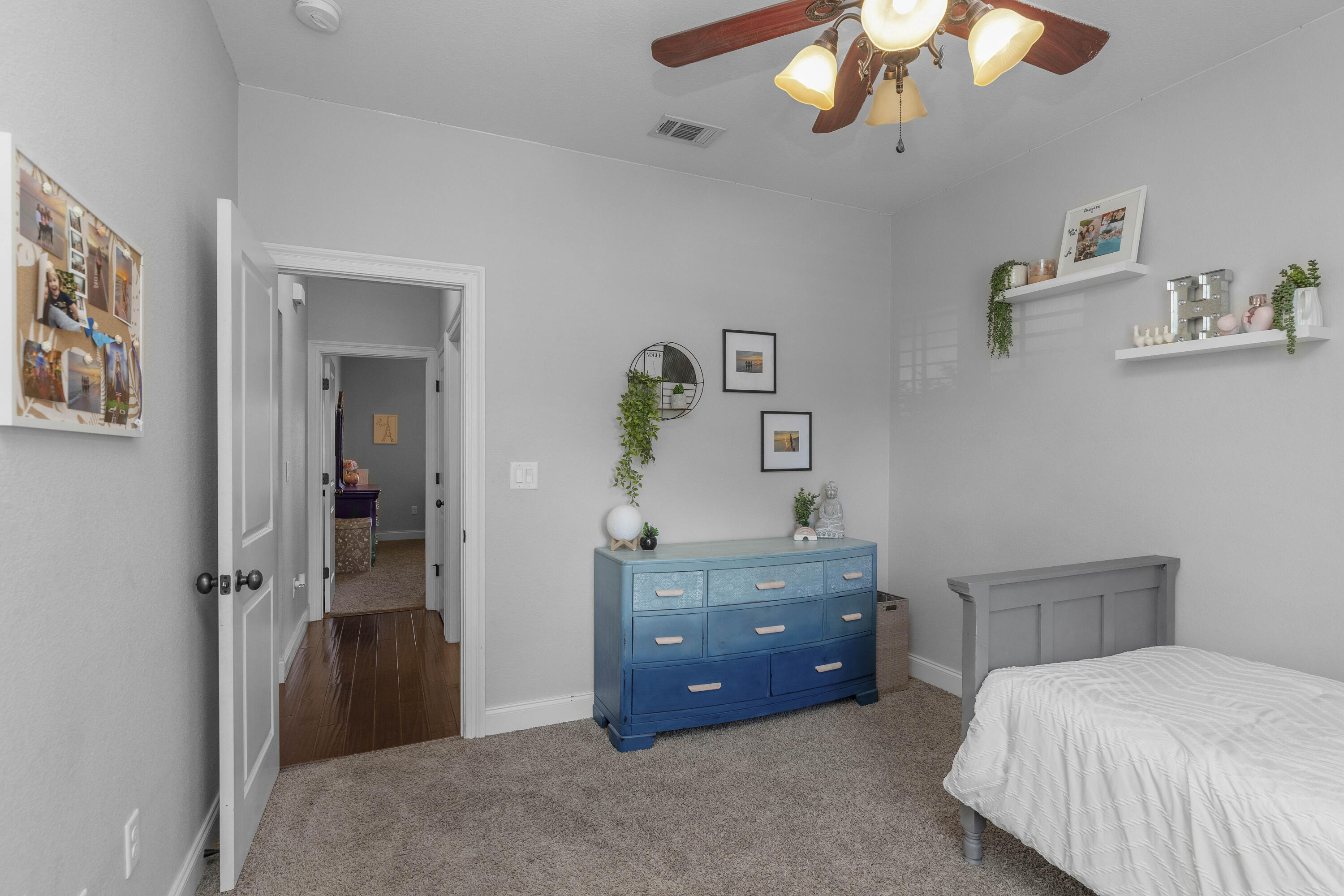 2946 Chantry Circle Crestview, FL 32539 - Photo 37 of 55 a bedroom with a bed and a chandelier
