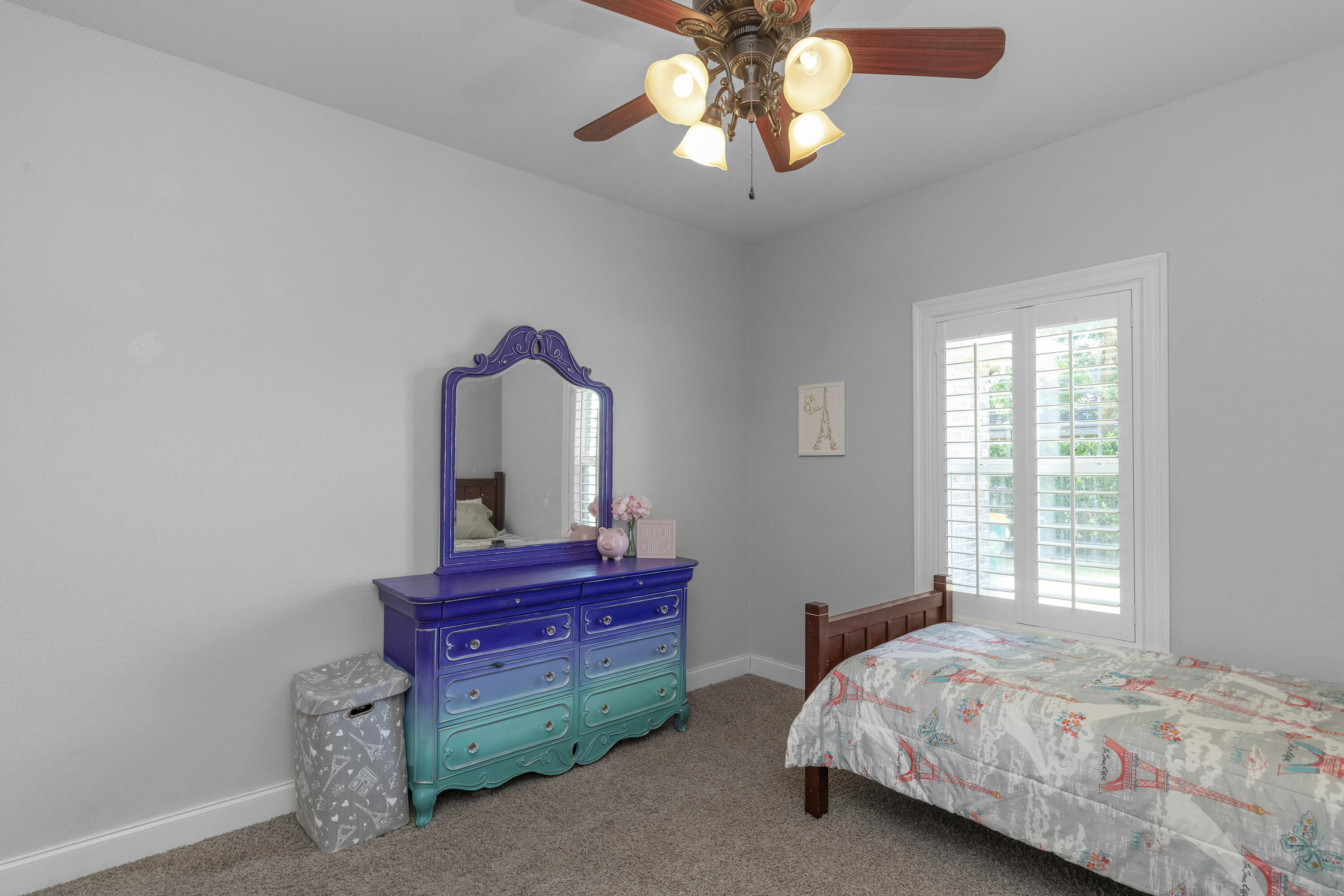 2946 Chantry Circle Crestview, FL 32539 - Photo 39 of 55 a bedroom with a bed and a chandelier