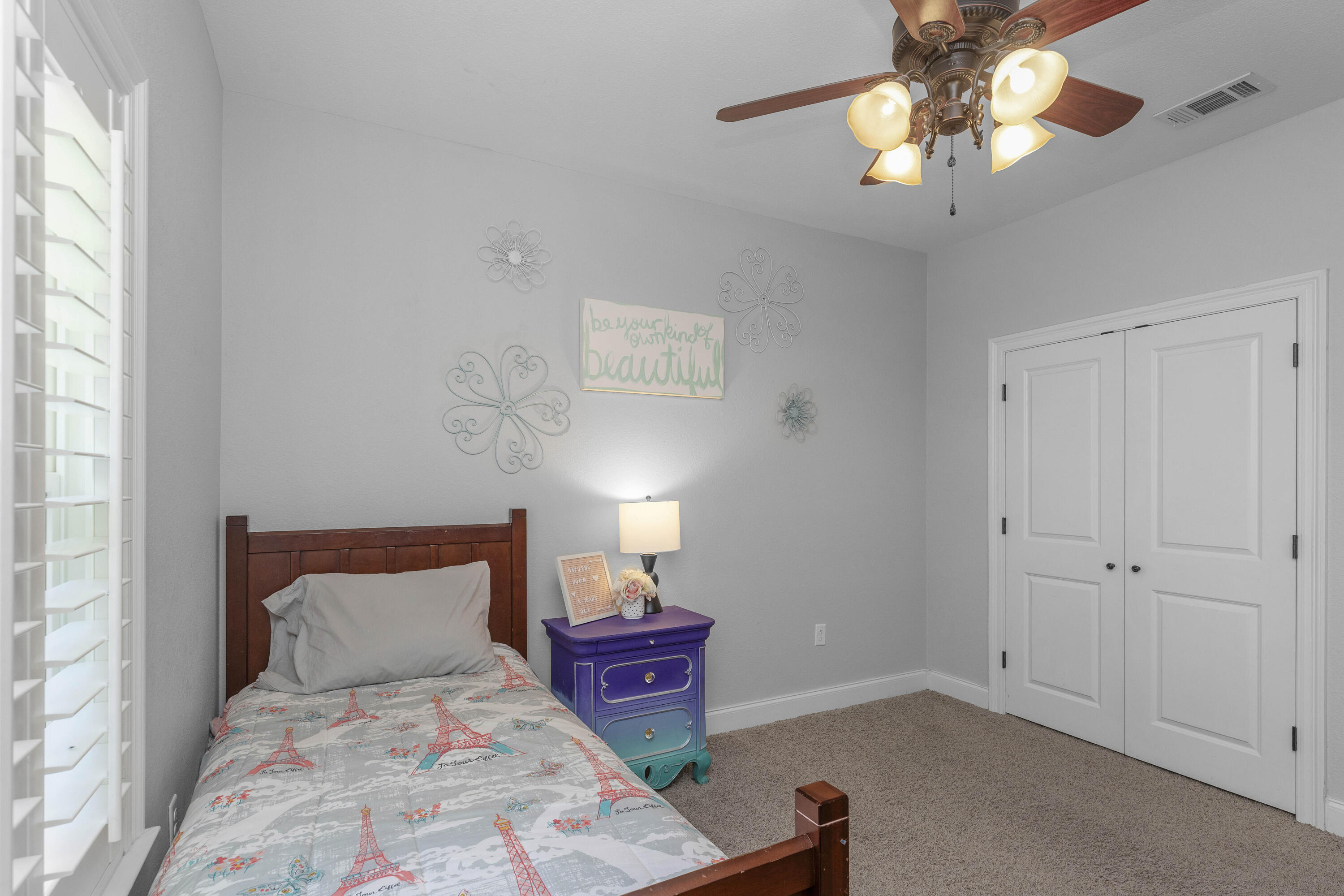 2946 Chantry Circle Crestview, FL 32539 - Photo 40 of 55 a bedroom with a bed and a chandelier