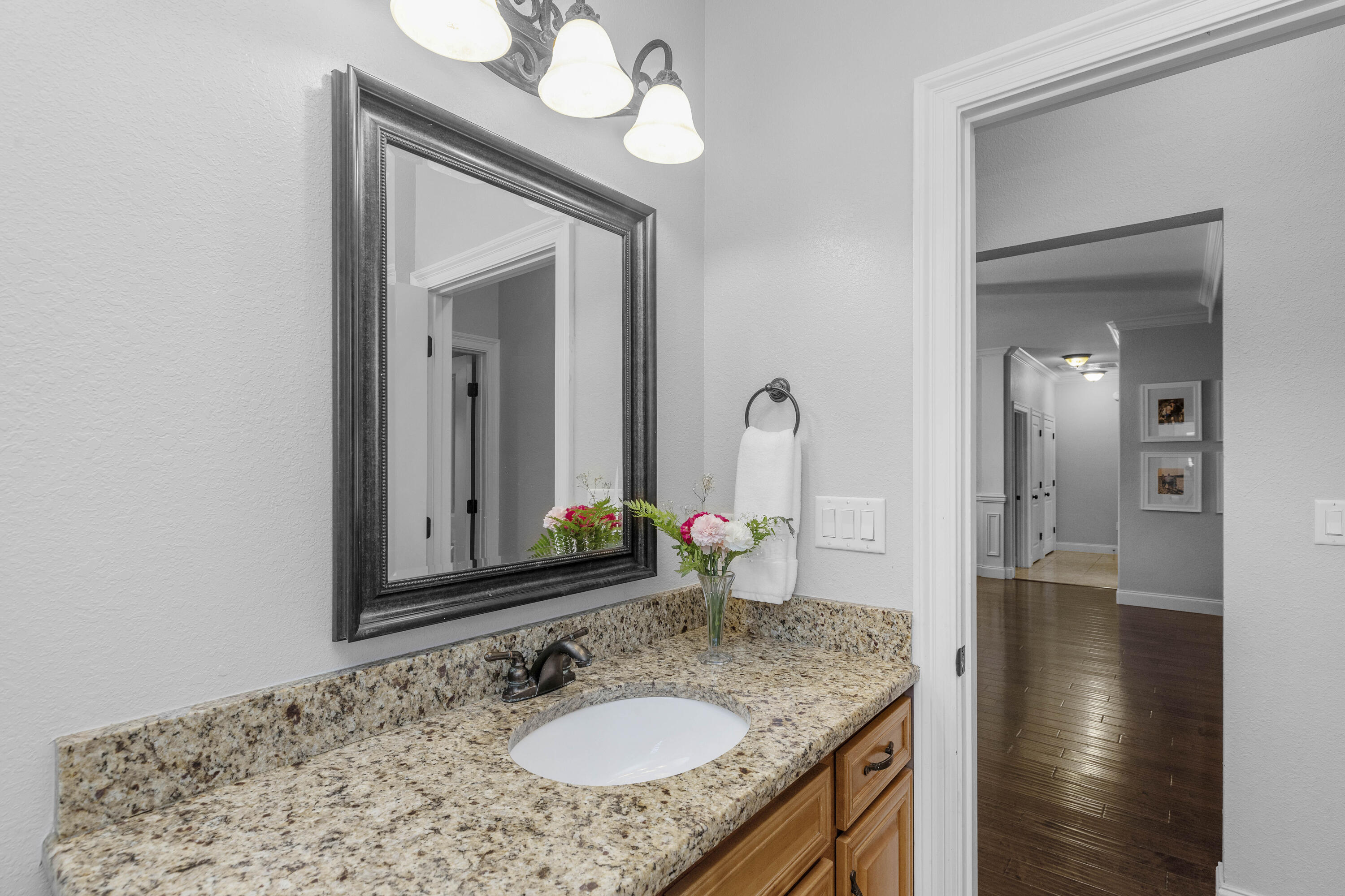 2946 Chantry Circle Crestview, FL 32539 - Photo 42 of 55 a en suite bathroom with a granite countertop sink and a mirror