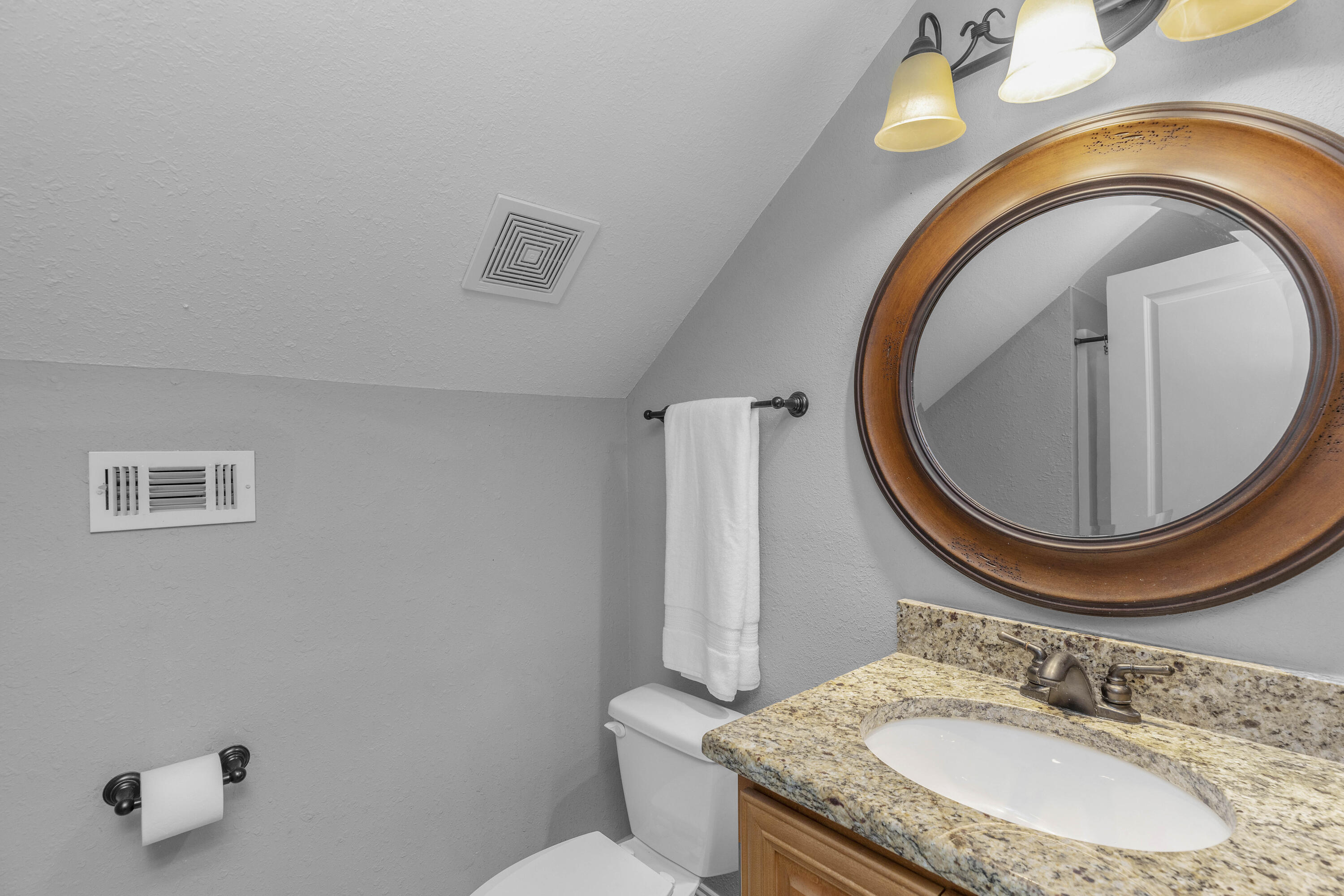 2946 Chantry Circle Crestview, FL 32539 - Photo 46 of 55 a bathroom with a granite countertop toilet a sink and mirror
