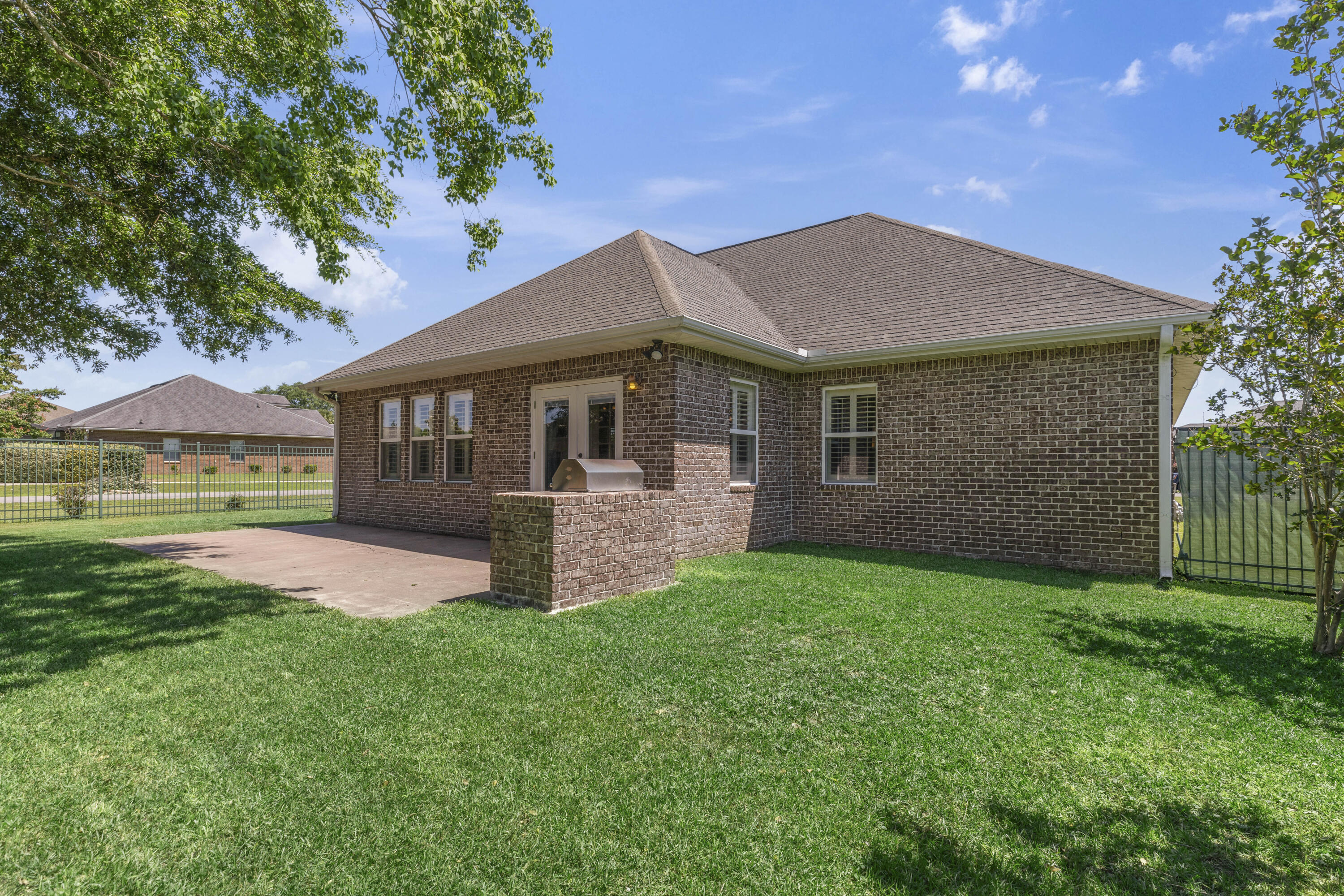 2946 Chantry Circle Crestview, FL 32539 - Photo 52 of 55 a front view of a house with a garden