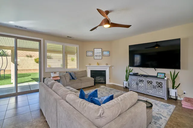 a kitchen with stainless steel appliances granite countertop a sink refrigerator and cabinets