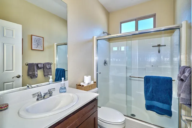 a view of a patio with a table and chairs