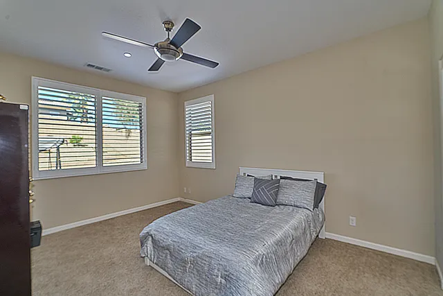 a view of a house with a backyard porch and sitting area