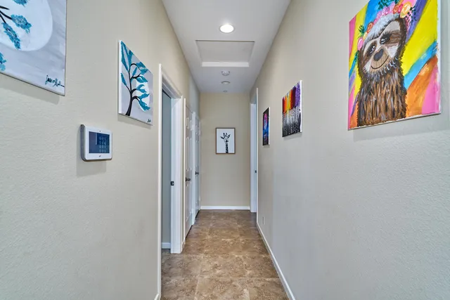 a view of a white house with a large window