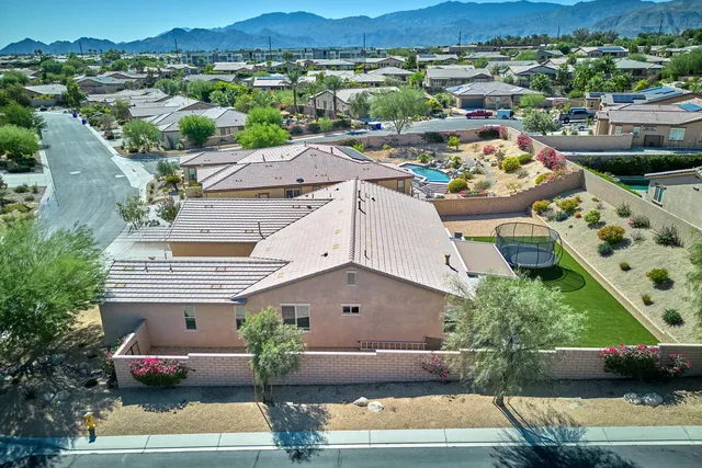 an aerial view of a house with a garden