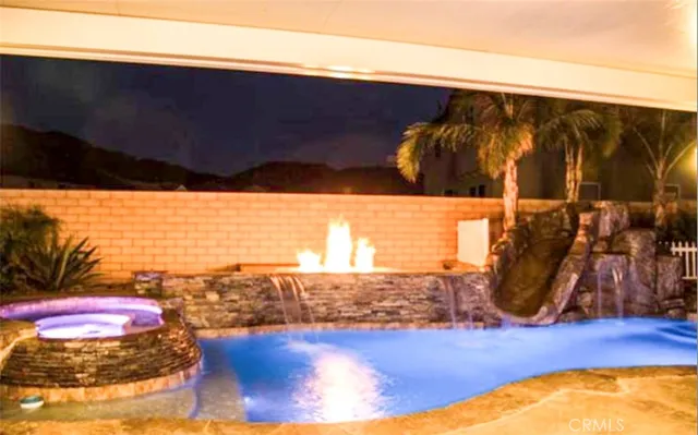a view of a backyard with table and chairs
