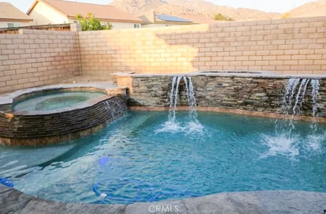 a kitchen with stainless steel appliances granite countertop a stove top oven a sink dishwasher and cabinets