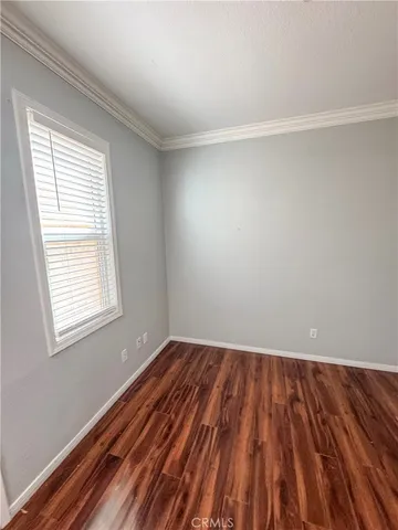 a living room with a couch and a ceiling fan