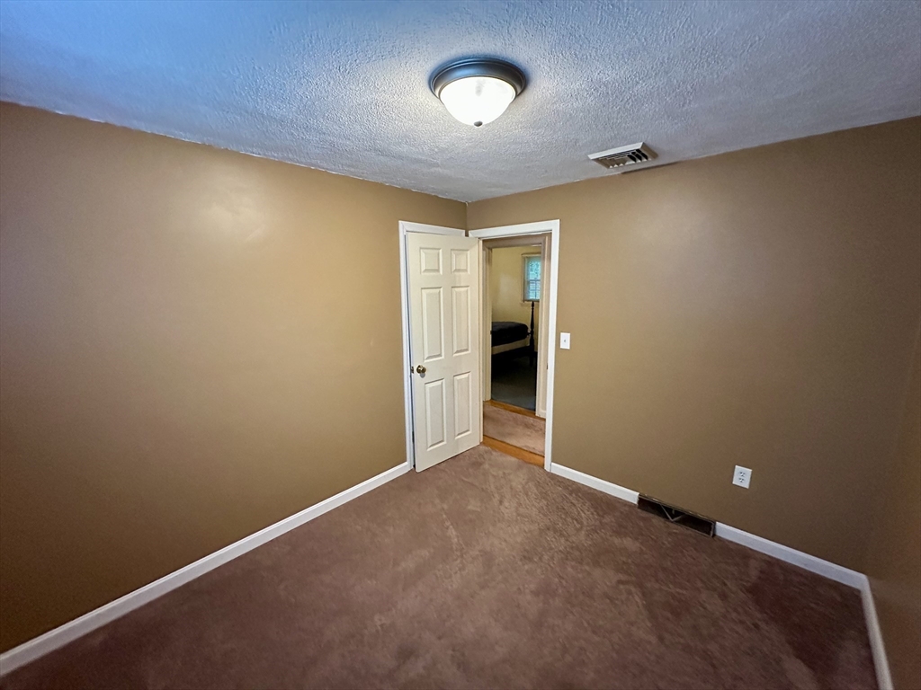 64 Maplewood Drive Townsend, MA 01469 - Photo 13 of 18 an empty room with a natural light